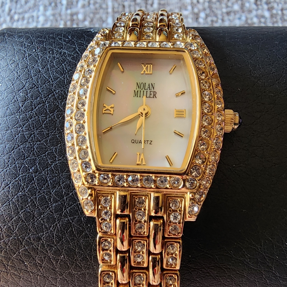 Vintage Nolan Miller crystal gold-tone watch.